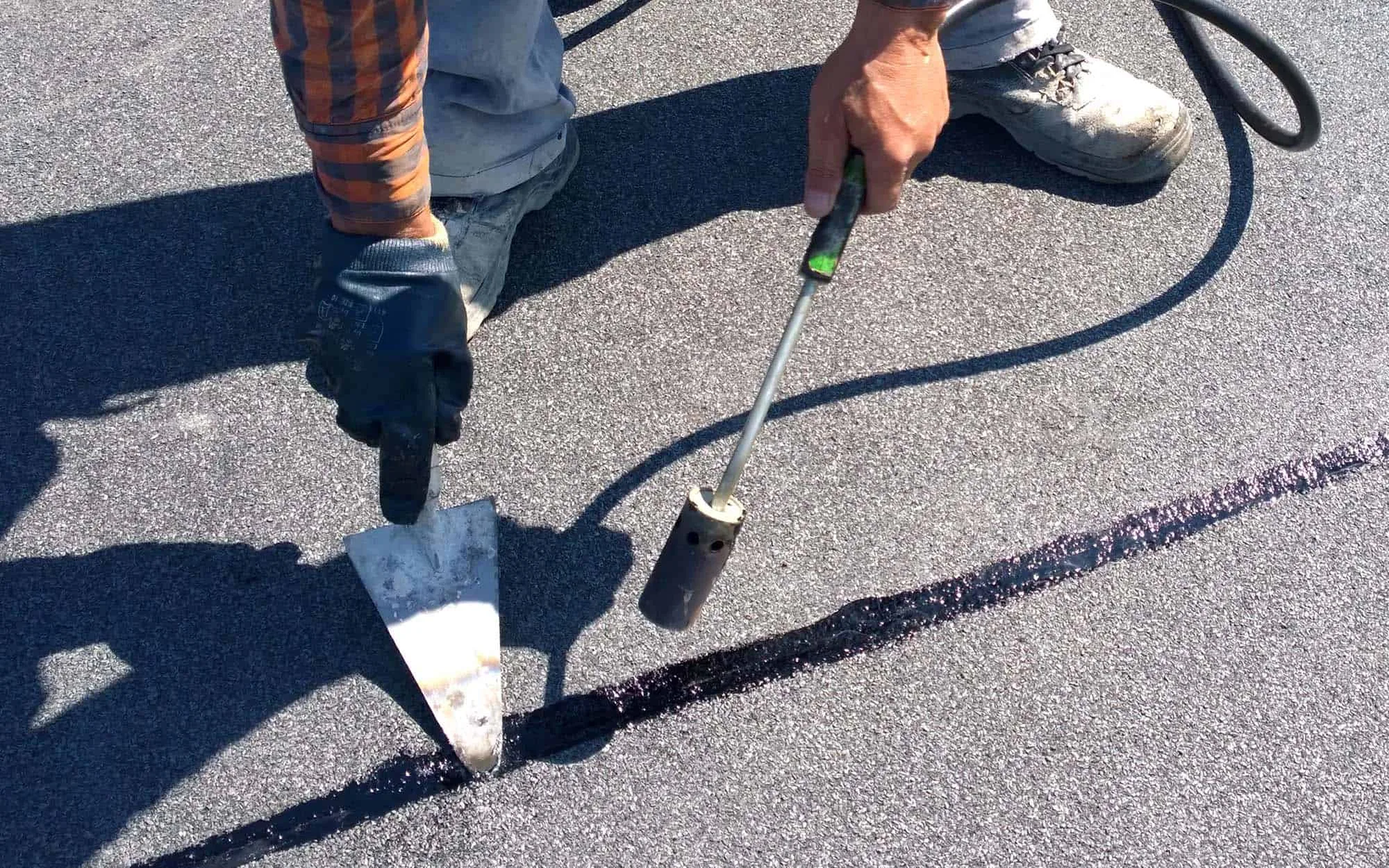 Close-up-view-of-a-person-using-heat-gun-to-seal-epdm-1